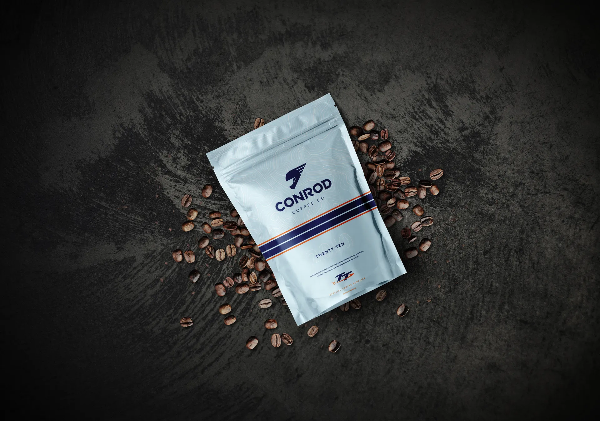 Conrod Coffee Co Twenty-Ten blend coffee bag surrounded by coffee beans, photographed by DotPerformance for the Conrod Coffee Co website and e-commerce store